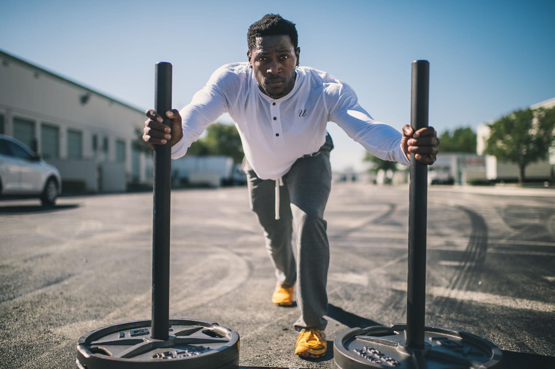 Athlete pushing a weighted sled