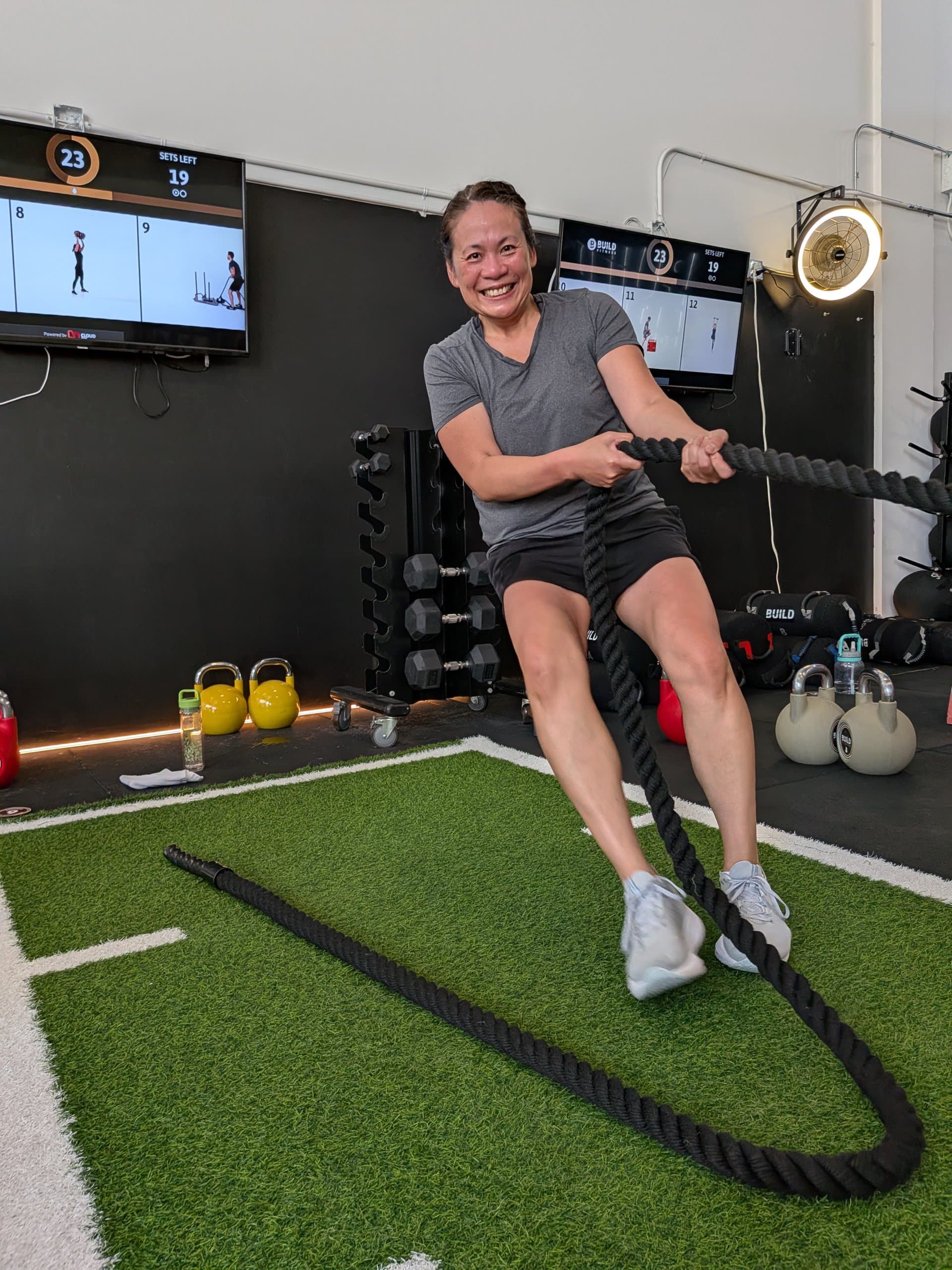 Member training with battle ropes at Build Fitness in Port Coquitlam